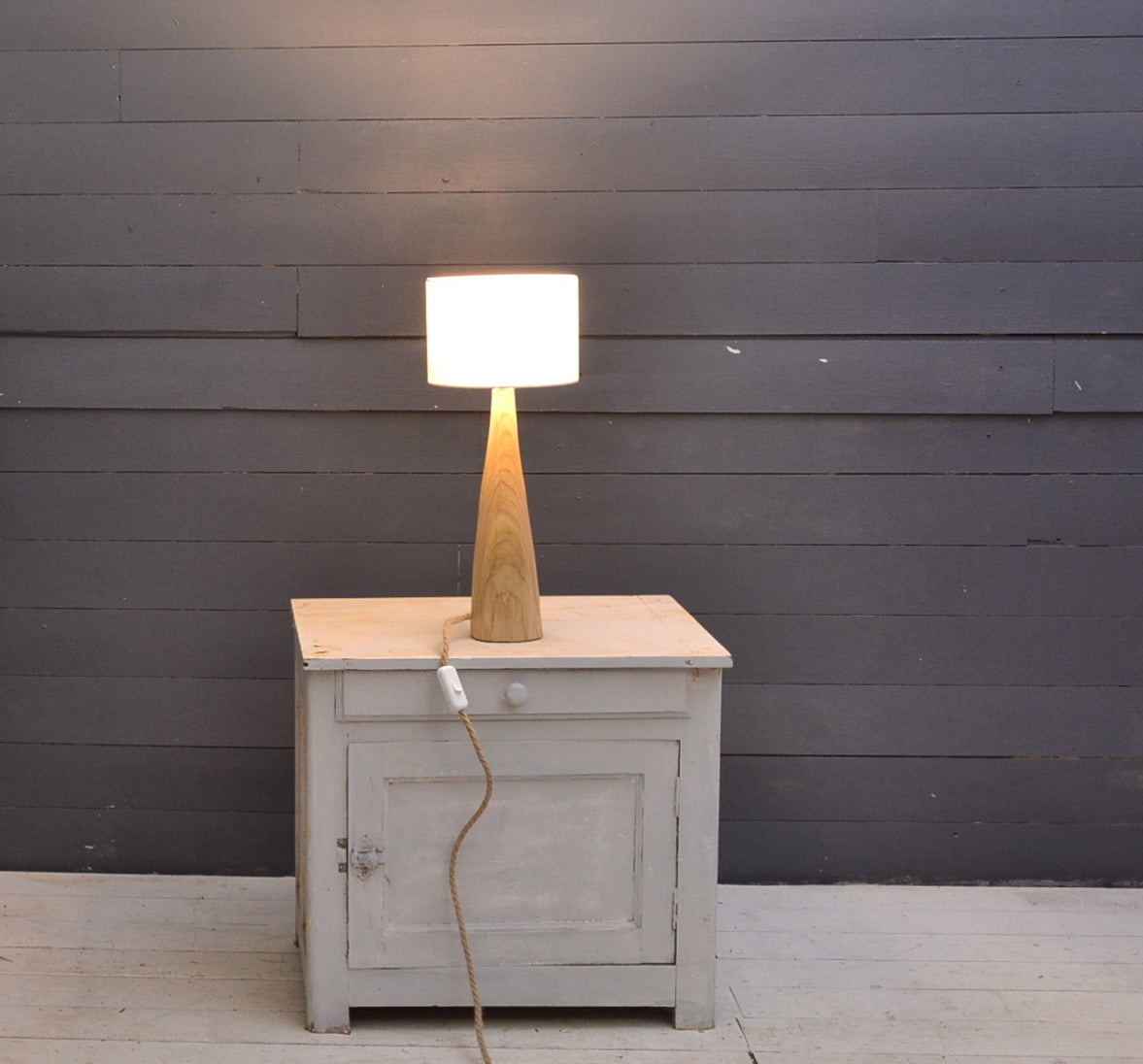 Table lamp in chestnut wood, conical shape